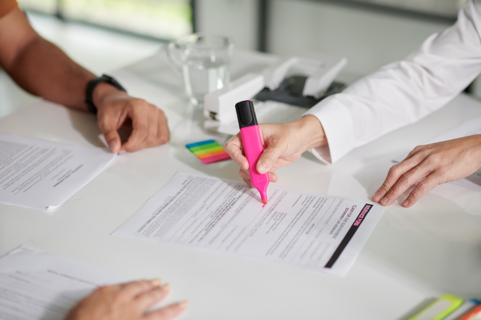 Mortgage specialist highlighting key data in a governance document